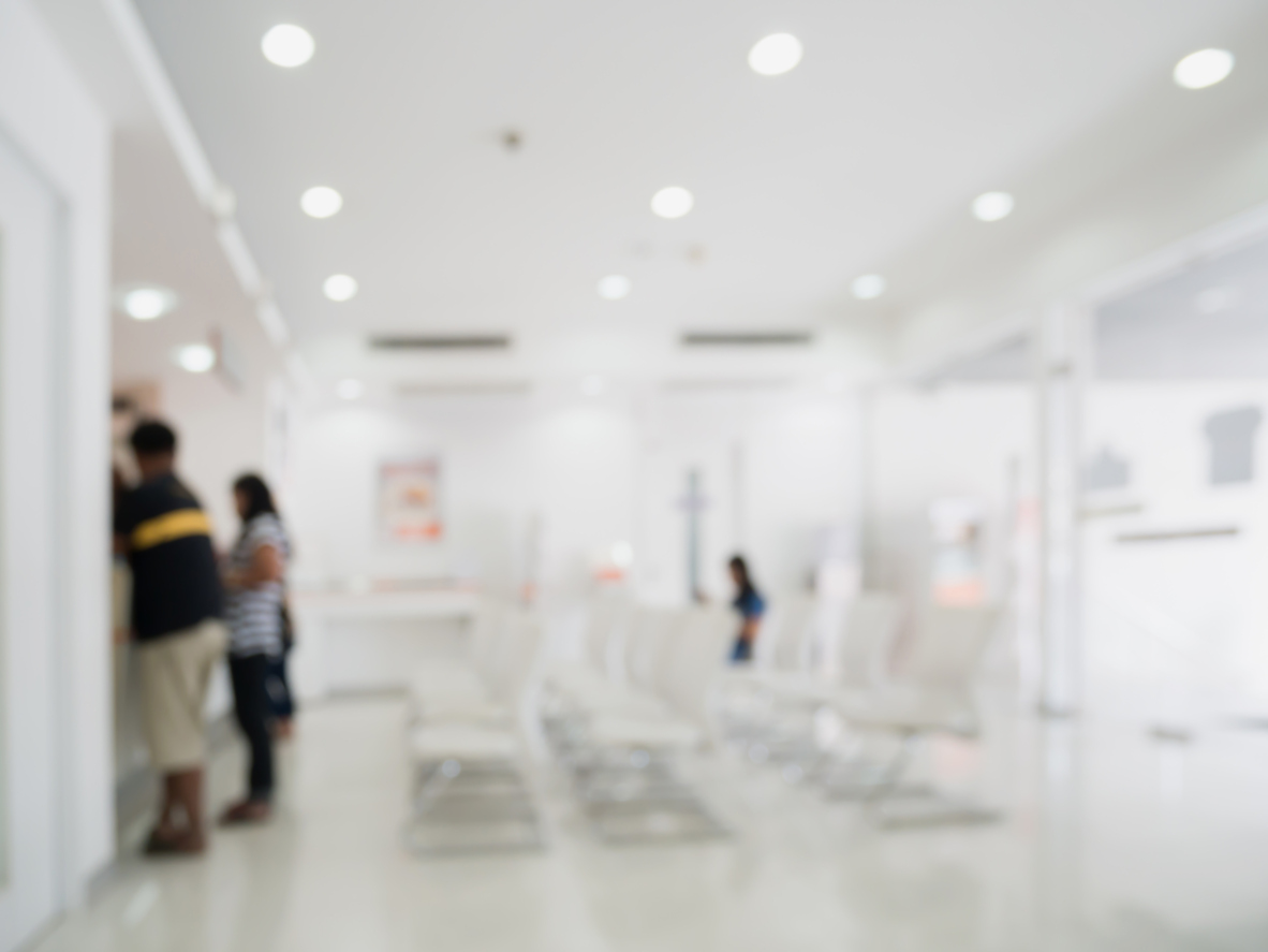 Blur abstract hospital interior background with customer or patients at counter